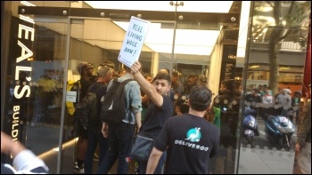 'Self-employed' Deliveroo workers striking against pay cuts, photo James Ivens